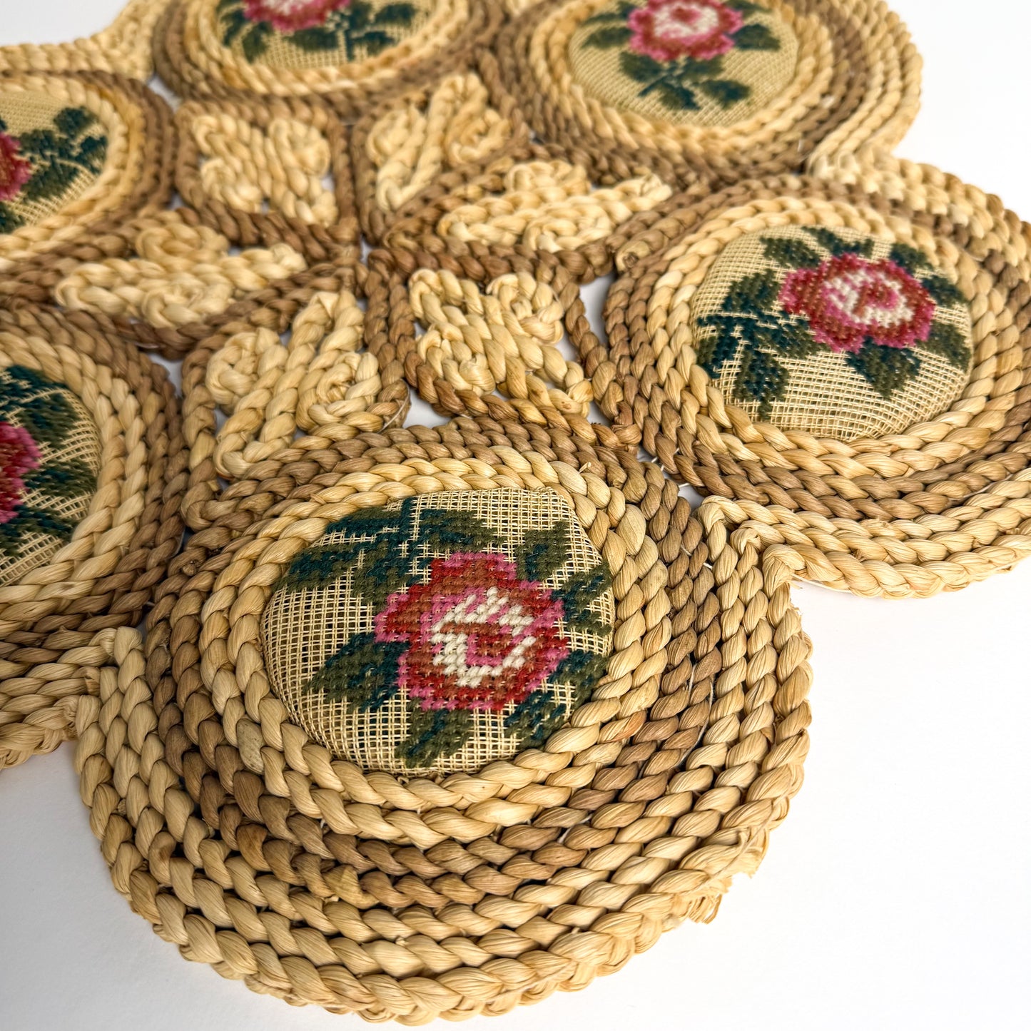 Raffia, straw, & needlepoint floral table trivet