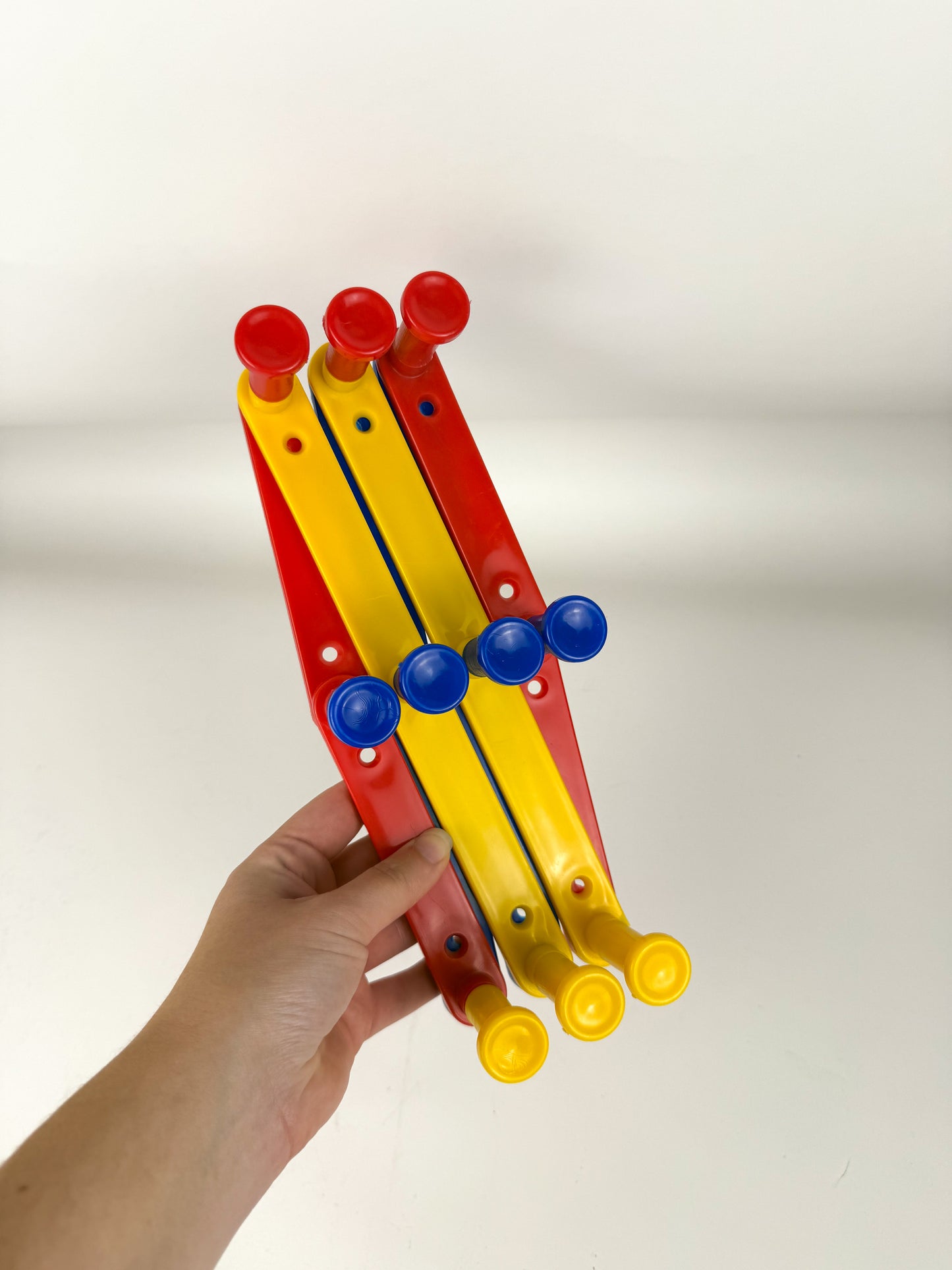 Vintage primary peg rack