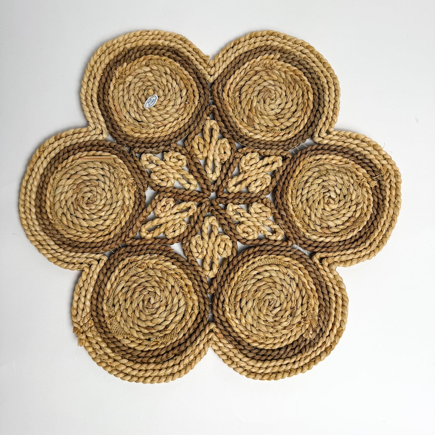 Raffia, straw, & needlepoint floral table trivet
