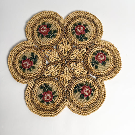 Raffia, straw, & needlepoint floral table trivet