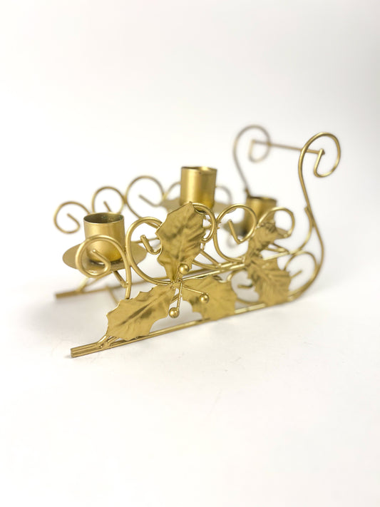 Brass sleigh candlestick holder